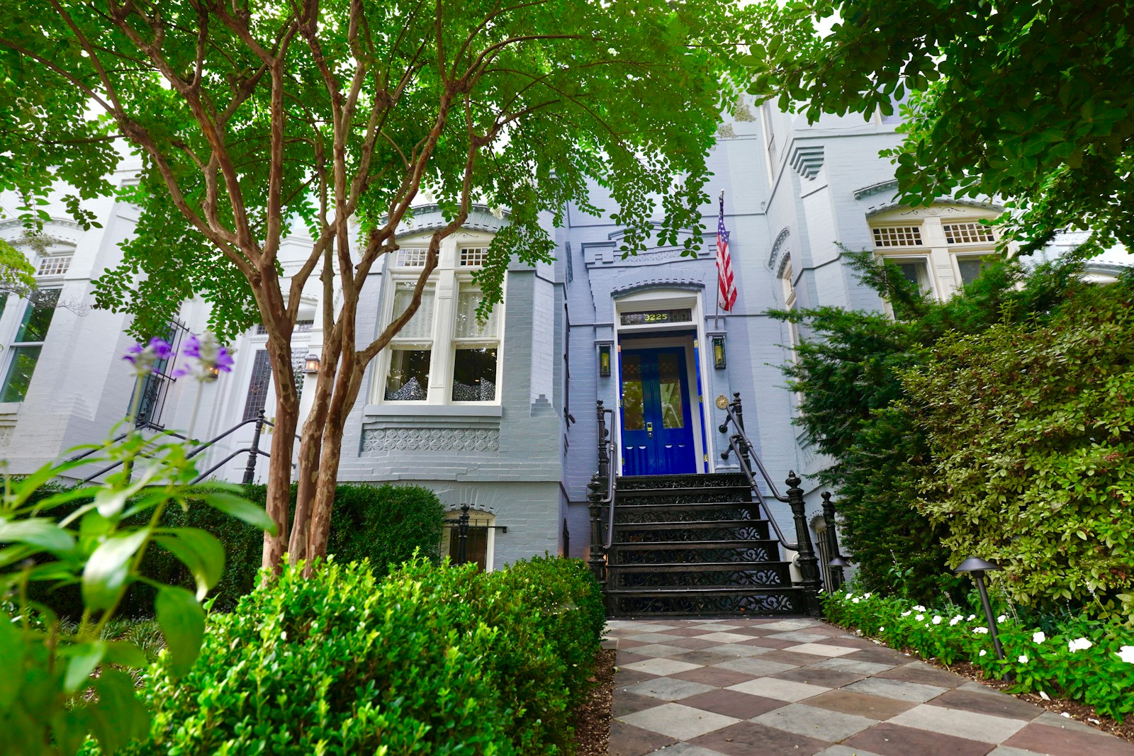 A beautiful house with a blue door.